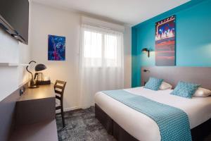 En eller flere senge i et værelse på Best Western Hotel Atlantys Zenith Nantes