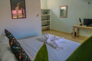 Postel nebo postele na pokoji v ubytování Divine Divers Gili Meno