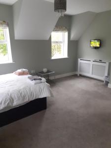 Voodi või voodid majutusasutuse Bedroom No 3 Garden view toas