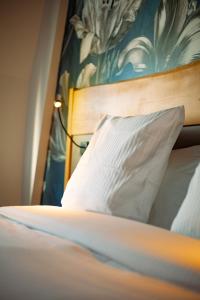 Postel nebo postele na pokoji v ubytování Berti Hotel - Mulhouse Centre Gare