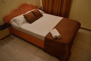 Ένα ή περισσότερα κρεβάτια σε δωμάτιο στο Bluestar Appartement 3, centre de Grand Baie