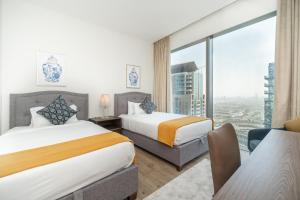 Postel nebo postele na pokoji v ubytování Luton Vacation Homes - Luxury & High floor 2BR , Jumeirah Living Marina Gate 3 - 48AB07 + 37 fotografií