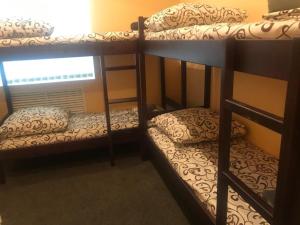 a couple of bunk beds in a room at DESYATINNAYA Hostel in Kyiv