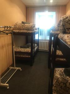 Postel nebo postele na pokoji v ubytování DESYATINNAYA Hostel