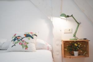 Łóżko lub łóżka w pokoju w obiekcie Apartamentos LÓRIEN Zarautz
