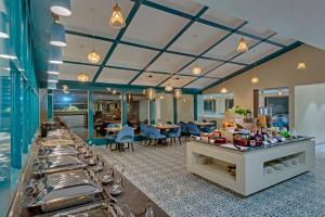 A restaurant or other place to eat at The Fern Residency Hubballi