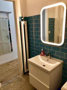 a bathroom with a sink and a mirror at BUDAPEST4U - New apt in the central of Budapest in Budapest +6 photos