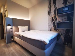 Postel nebo postele na pokoji v ubytování Hotel Grille