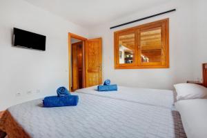 Posteľ alebo postele v izbe v ubytovaní Las Casitas 28