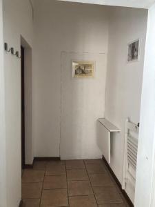 a room with a refrigerator and a tile floor at Camera San Jacopo in Altopascio