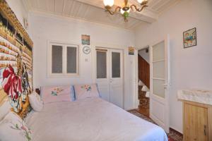 a bedroom with a large bed in a room at Skopelos house in Castle in Panormos Skopelos