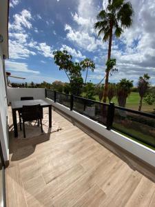 a balcony with a table and a view at Residencial Bitacora in San Miguel de Abona