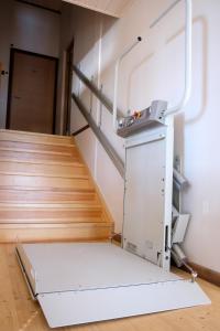 an elevator in a room with a staircase at LVM tūrisma un atpūtas centrs "Spāre" in Spāre