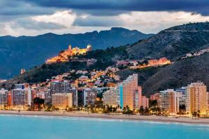 a city on the shore of a body of water at Apto POSEIDON CON PARKING EN EDIFICIO SUBTERRANEO in Cullera