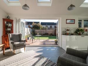 a living room with a view of a patio at Sandy Toes in Christchurch