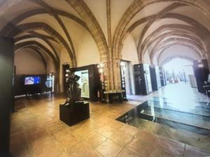 a museum with a statue in the middle of a building at Apto POSEIDON CON PARKING EN EDIFICIO SUBTERRANEO in Cullera