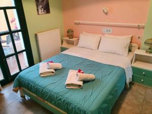 Posteľ alebo postele v izbe v ubytovaní Dioskouroi Apts