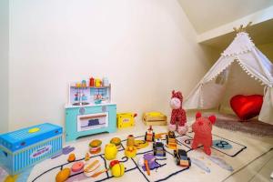 a childs play room with toys on the floor at Rice mansion in Wujie