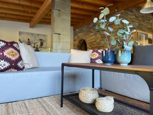 a table with two blue vases on top of it at International House Sölden in Sölden