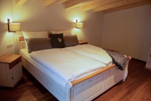 En eller flere senge i et værelse på Das Neue Sonnberg Living, SKI IN-SKI OUT