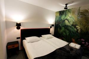 Łóżko lub łóżka w pokoju w obiekcie Lyck Apartamenty