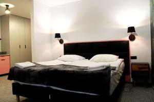 Łóżko lub łóżka w pokoju w obiekcie Lyck Apartamenty
