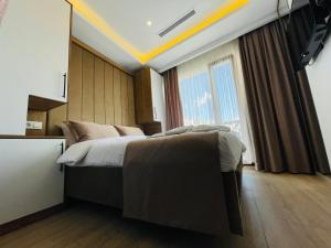 Ein Bett oder Betten in einem Zimmer der Unterkunft Zem Hotel