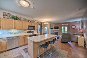 a large kitchen with a island and bar stools at Hunter Mountain Ski Retreat - Steps to Lift! in Hunter