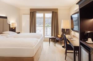 Ένα ή περισσότερα κρεβάτια σε δωμάτιο στο IMLAUER Hotel Schloss Pichlarn