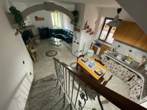 an overhead view of a kitchen and a living room at La Casa di Marco in Nuoro