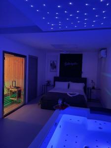a bedroom with a bed and a swimming pool at Arizona Motel in Castel Volturno