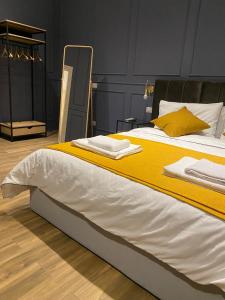 A bed or beds in a room at Allegra Suites