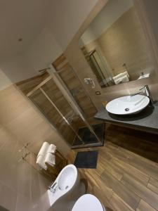 A bathroom at Allegra Suites