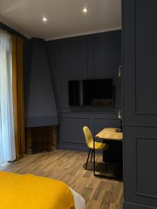 A television and/or entertainment centre at Allegra Suites