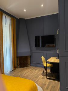 A television and/or entertainment centre at Allegra Suites