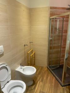 A bathroom at Allegra Suites