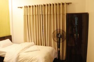 Postel nebo postele na pokoji v ubytování Serene B&B Kathmandu