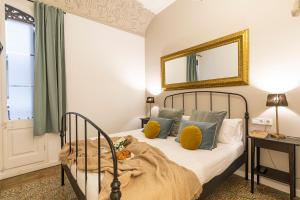 Posteľ alebo postele v izbe v ubytovaní Central Suites Barcelona