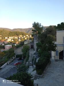 a view of a city with a castle and a street at Casafischea 21 Via Venino 21 B in Moneglia