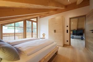Postel nebo postele na pokoji v ubytování Zugspitzerei - Premium Chalet Ferienwohnungen
