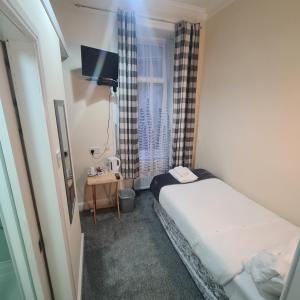 Lova arba lovos apgyvendinimo įstaigoje Glenmoore Guest House