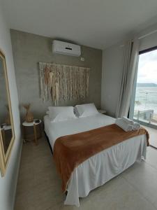 Cama ou camas em um quarto em Casatua Pousada