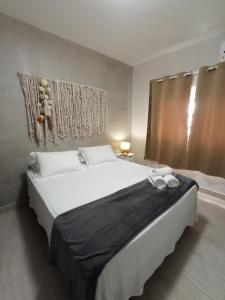 Cama ou camas em um quarto em Casatua Pousada
