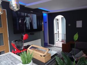 a living room with a table with a box on it at Movie nights and Chill in Manchester