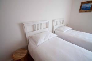 A bed or beds in a room at Casa Sass