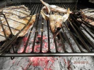a dead animal is sitting on a grill at Hostal Ezkurra in Ezkurra