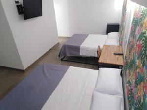 Postel nebo postele na pokoji v ubytování Hotel HACIENDA SAN AGUSTIN
