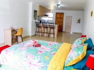 a living room with a bed and a kitchen at Proleefic House on Florence in Bellville