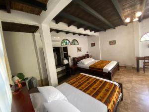 a bedroom with two beds in a room at Hotel Puerto Gaviota in Tonsupa