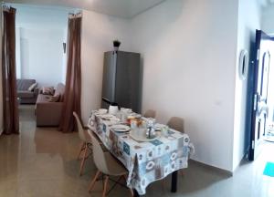 a table with a table cloth on it in a room at TANGER beach in Tangier